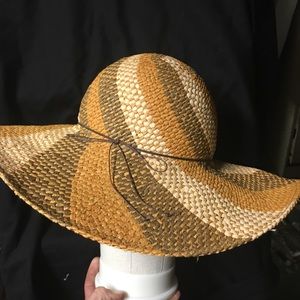Wide brimmed floppy hat by Mark.